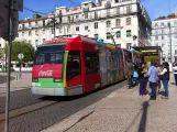 Lissabon Straßenbahnlinie 15E mit Niederflurgelenkwagen 506 am Praça da Figueira (2013)